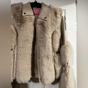 A medium faux leather and fur coat! Very nice never worn before…